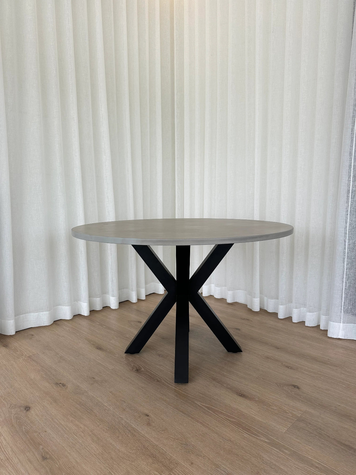 Indoor/Outdoor Round Concrete Dining Table - Black or White Spider Base | Mitchell Bink Concrete Design